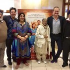 7 - IMAGE _ Gurinder Chadha with husband, family and Hugh Bonneville