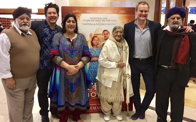 7 - IMAGE _ Gurinder Chadha with husband, family and Hugh Bonneville