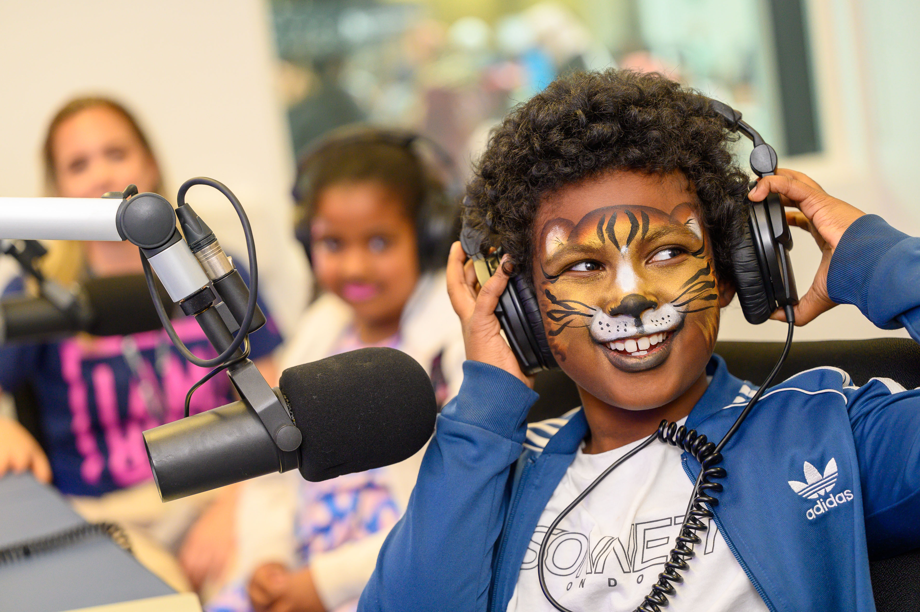 A visitor to the BCU Inspired Family Day takes part in a radio workshop