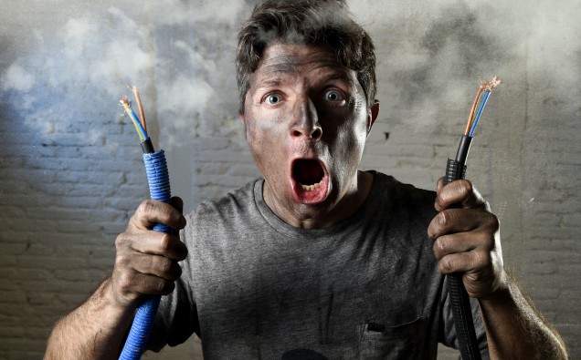 untrained electrocuted man plugging cable suffering electrical accident