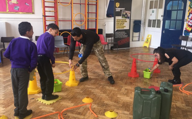Commando Joe Ricky Atkins helping pupils with activity