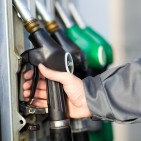 Man holding a fuel nozzle