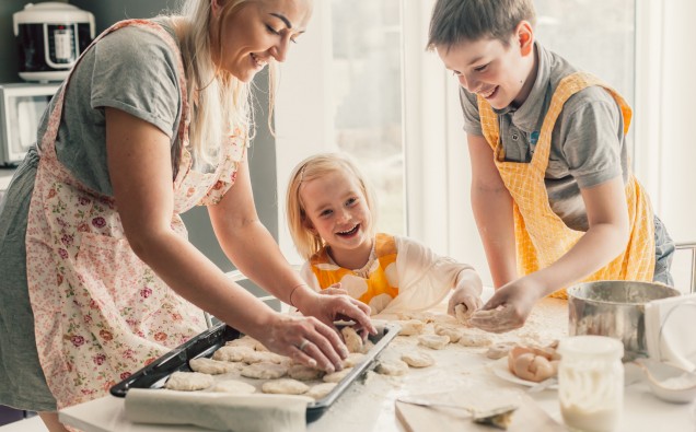 Mom cooking with kids on the kitchen