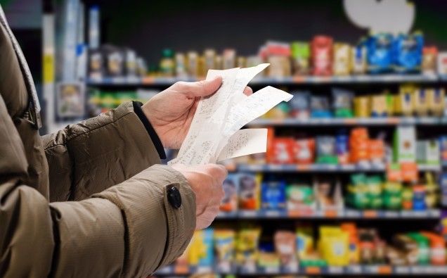 Minded,Man,Viewing,Receipts,In,Supermarket,And,Tracking,Prices