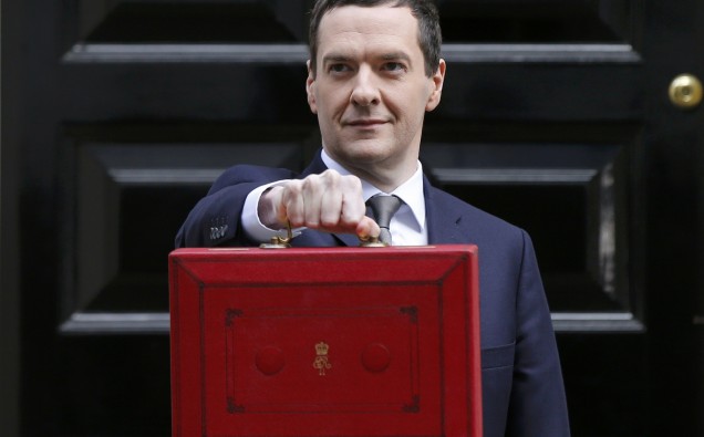 Britain's Chancellor of the Exchequer, George Osborne, holds up his budget case for the cameras as he stands outside number 11 Downing Street in central London