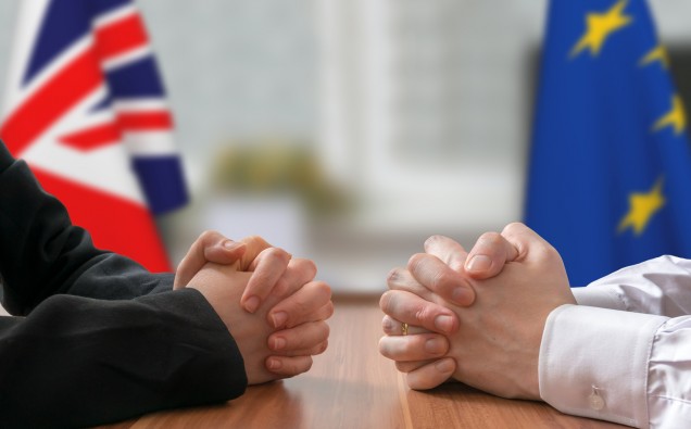Negotiation of Great Britain and European Union (Brexit). Statesman or politicians with clasped hands.