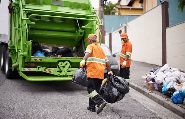 Cropped shot of a garbage collection team at work