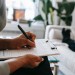 doctor-taking-notes-with-patient.x81a22fe2