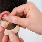 fitting-hearing-aid-434577