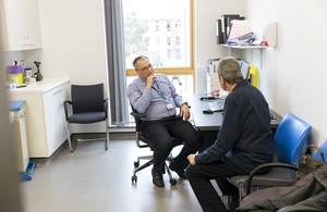 s300_Male_doctor_and_patient_talking_in_consultation_room