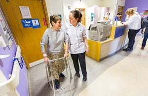 s300_patient_with_walking_support_and_staff_member